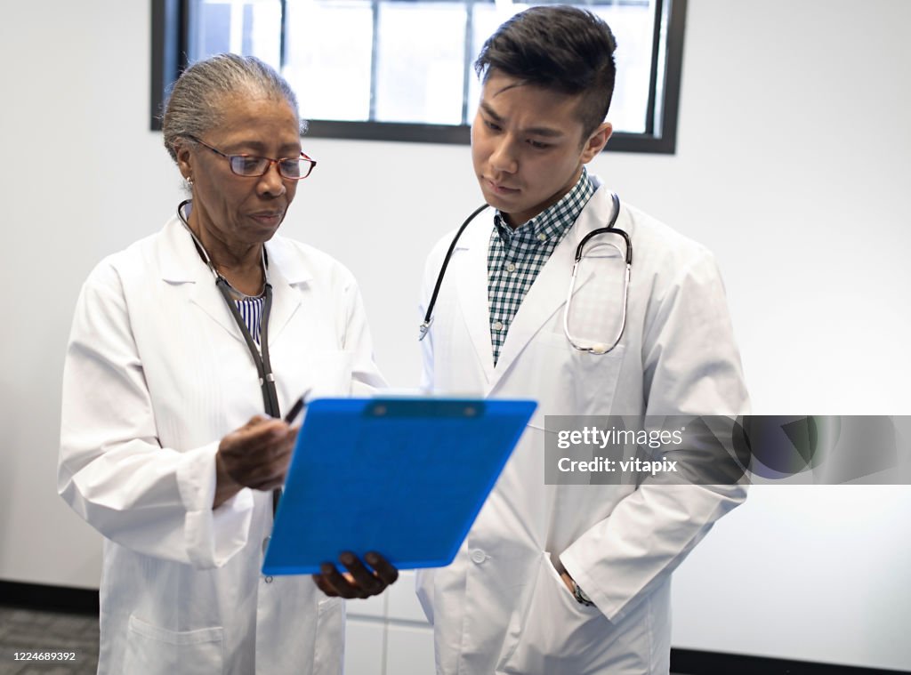 Two Doctors Talking High-Res Stock Photo - Getty Images