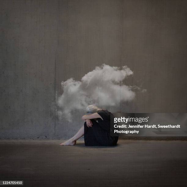 manipulated photo of a woman on ground looking away from camera head covered in a cloud - mourning stock pictures, royalty-free photos & images