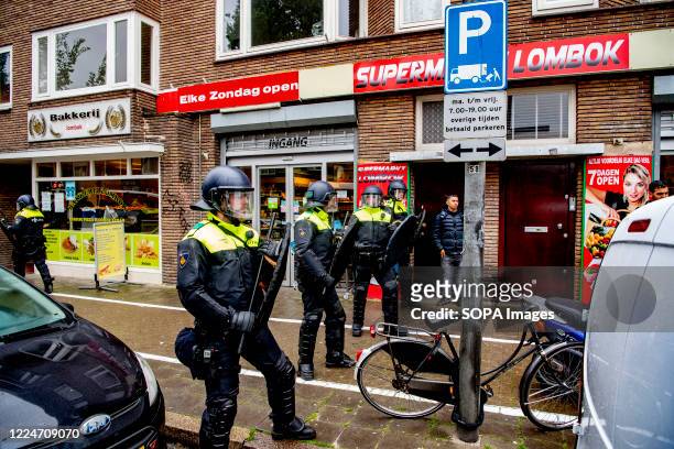 Police officers patrol the streets of Utrecht to stop demonstrators from carrying on the demonstrations. Police officers from the Mobile Unit in...