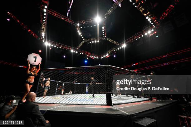 Ring girl walks around the octagon Hunter Azure of the United States fights Brian Kelleher of the United States in their Men's Bantamweight bout...