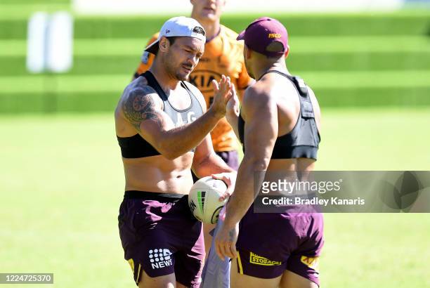Alex Glenn and Jamil Hopoate do their handshake during a Brisbane Broncos NRL training session at the Clive Berghofer Centre on May 14, 2020 in...