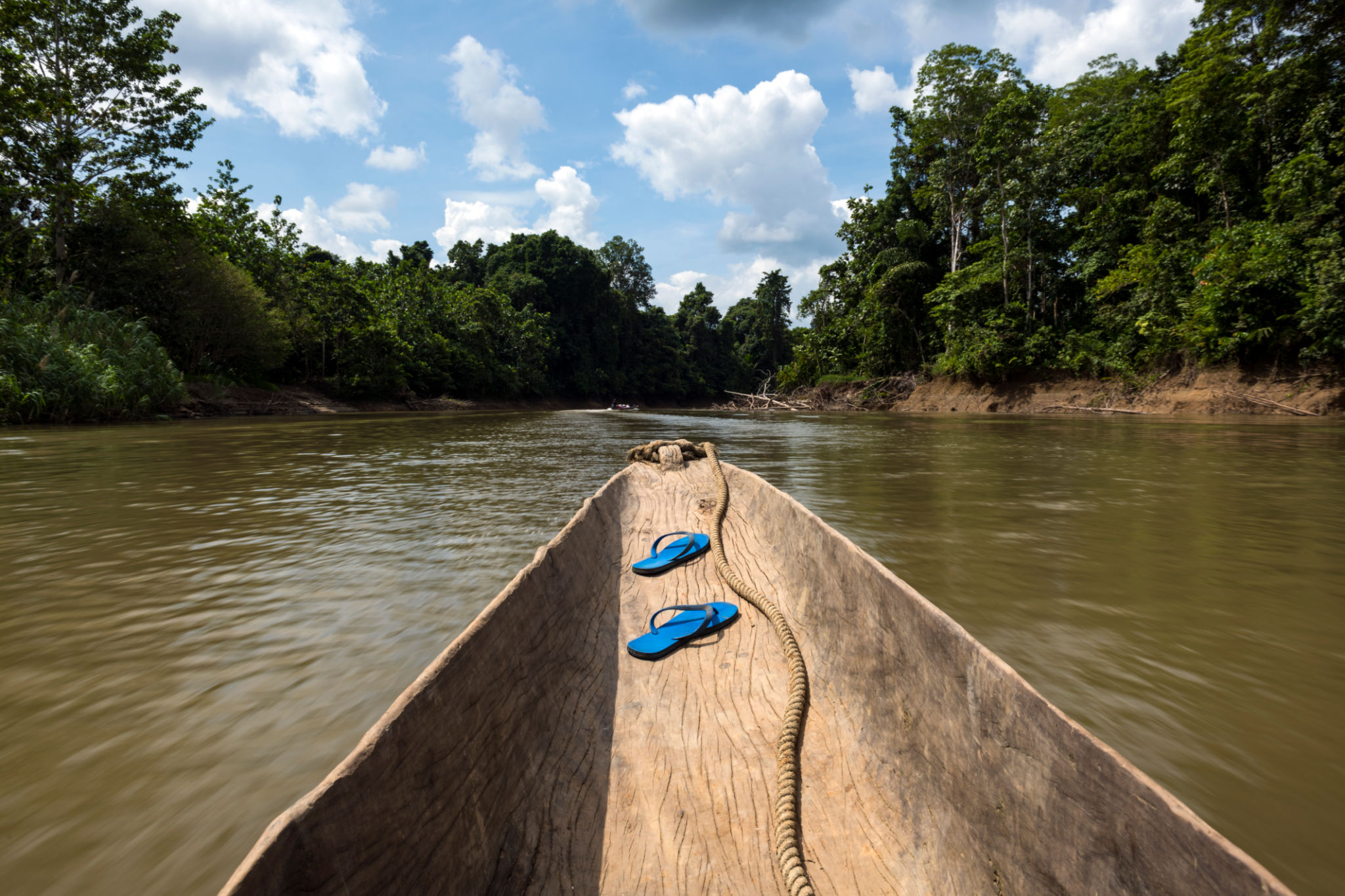 Traveling by dugout canoe in Papua New Guinea Traveling by dugout canoe in Papua New Guinea