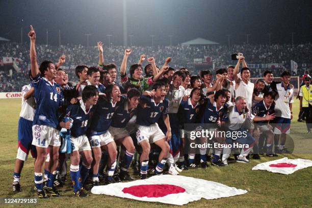 Japanese players celebrate after their 3-2 victory in the FIFA World Cup France Asian Play-Off match between Japan and Iran at the Larkin Stadium on...