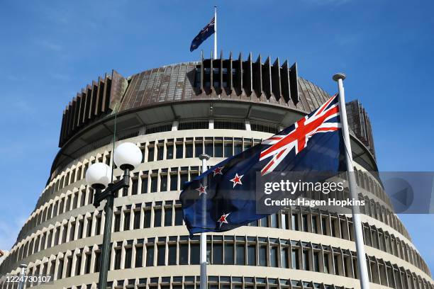 The New Zealand flag flies in front of The Beehive during Budget 2020 delivery day at Parliament May 14, 2020 in Wellington, New Zealand. Budget 2020...