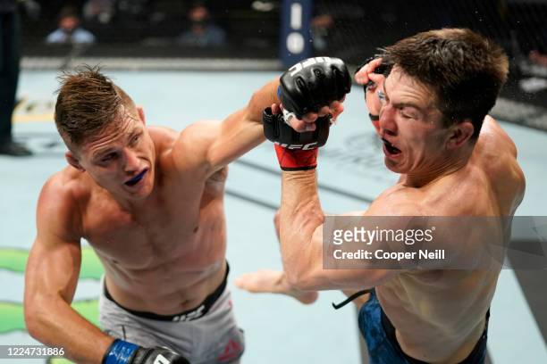 Drew Dober punches Alexander Hernandez in their bantamweight bout during the UFC Fight Night Event at VyStar Veterans Memorial Arena on May 13, 2020...