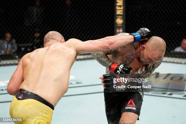 Glover Teixeira of Brazil punches Anthony Smith in their light heavyweight bout during the UFC Fight Night Event at VyStar Veterans Memorial Arena on...