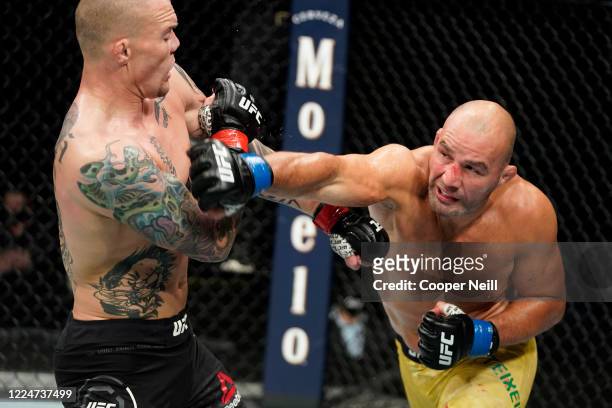 Glover Teixeira of Brazil punches Anthony Smith in their light heavyweight bout during the UFC Fight Night Event at VyStar Veterans Memorial Arena on...
