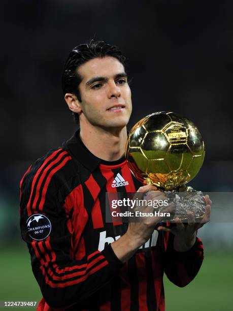 Kaka of AC Milan lifts the FIFA Player of the Year trophy prior to the UEFA Champions League Group D match between AC Milan and Celtic at the Stadio...