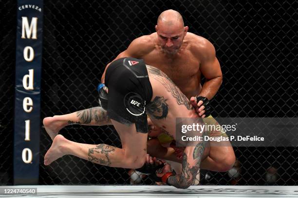 Glover Teixeira of Brazil fights Anthony Smith of the United States in their Light Heavyweight bout during UFC Fight Night at VyStar Veterans...