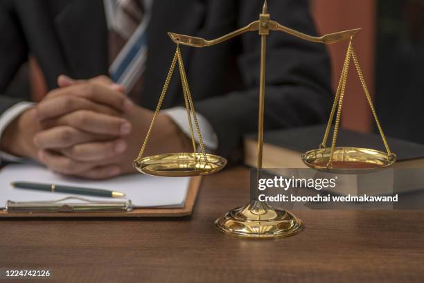 close up lawyer businessman working or reading lawbook in office workplace for consultant lawyer concept. - - studio legale foto e immagini stock