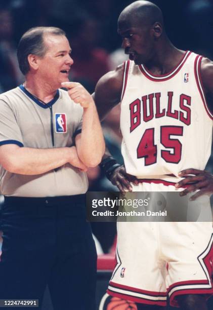 Michael Jordan of the Chicago Bulls talks with referee Joey Crawford during a game at the United Center on May 4, 1995 in Chicago, Illinois.