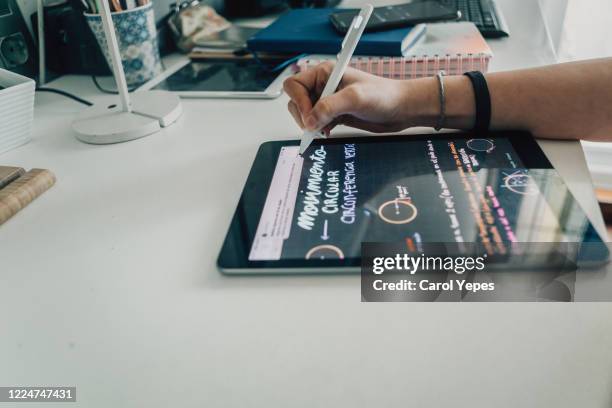 female teenager using pencil in digital tablet for writting notes - e learning draw stock pictures, royalty-free photos & images