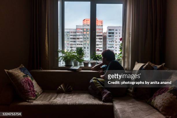 looking out from the window - quarantine stock pictures, royalty-free photos & images