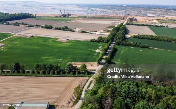 This aerial view shows Hambach surface mine close to the abandoned soccer field in Manheim-alt near Kerpen on April 26, 2020 in Cologne, Germany.