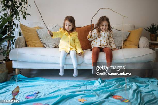 kids playing fishing at home - imagination stock pictures, royalty-free photos & images
