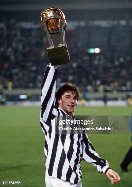 Alessandro Del Piero of Juventus celebrates the victory with the trophy after winnig the 1996 Intercontinental Cup match between Juventus and River...