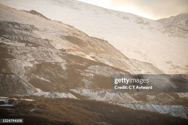 snow covered mountain and slate quarry - rock strata uk stock pictures, royalty-free photos & images