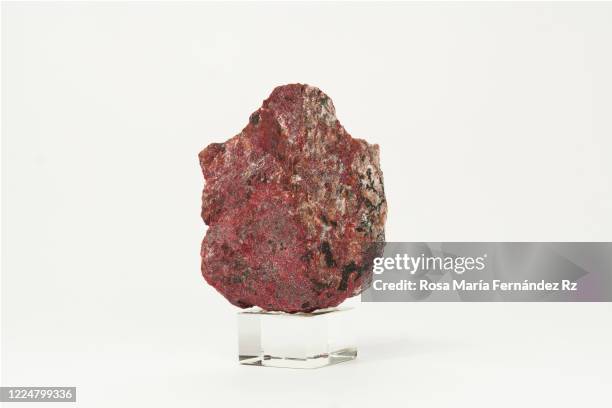 speciment of cinnabar. cinnabarite over white background. copy space. - calcita mineral fotografías e imágenes de stock