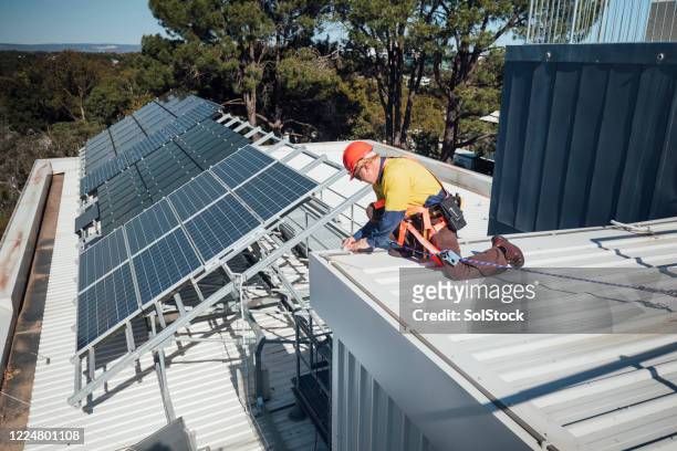 solar panel repair - roof inspector stock pictures, royalty-free photos & images