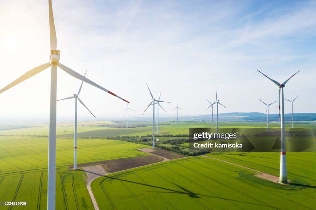 Aerial view of wind turbines and agriculture field