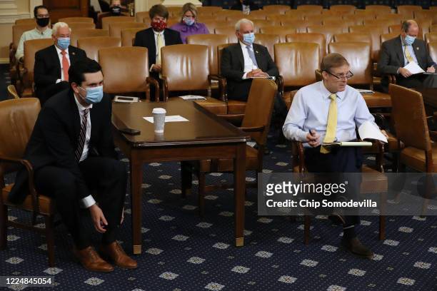 With the exception of Rep. Jim Jordan , members of Congress and their staff wear face masks during a House Rules Committee hearing about the proposal...