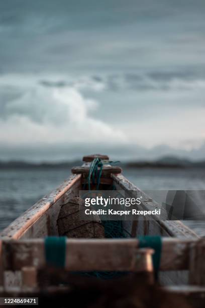lonely fishing boat - timber deck stock-fotos und bilder