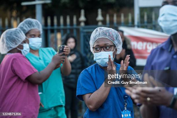 Workers applaud key workers at Kings College Hospital in South London on May 14, 2020 in London, United Kingdom. Following the success of the "Clap...