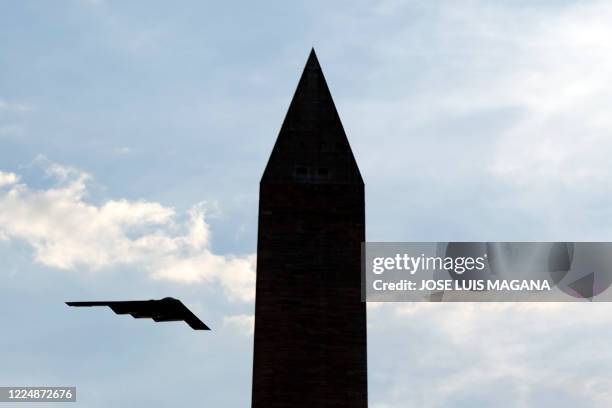 Stealth Bomber flies over the Washington Monument at the National Mall, during the Independence Day celebrations in Washington DC on July 4, 2020.