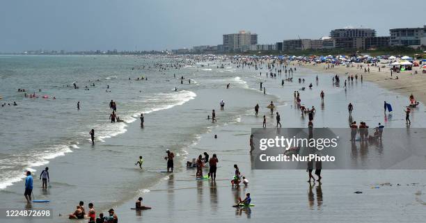 People celebrate Independence Day by visiting the beach on July 4, 2020 in Cocoa Beach, Florida. Crowds at the beach were below normal for a holiday...