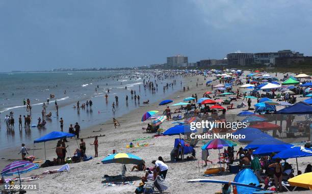 People celebrate Independence Day by visiting the beach on July 4, 2020 in Cocoa Beach, Florida. Crowds at the beach were below normal for a holiday...