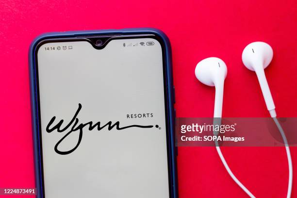 In this photo illustration the Wynn Resorts logo seen displayed on a smartphone.