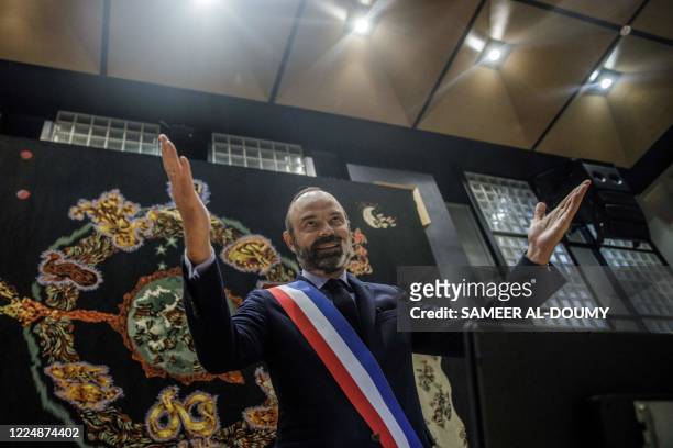 French former Prime Minister Edouard Philippe opens his arms as he reacts after being officialy elected as Le Havre mayor on July 5, 2020 in Le Havre...