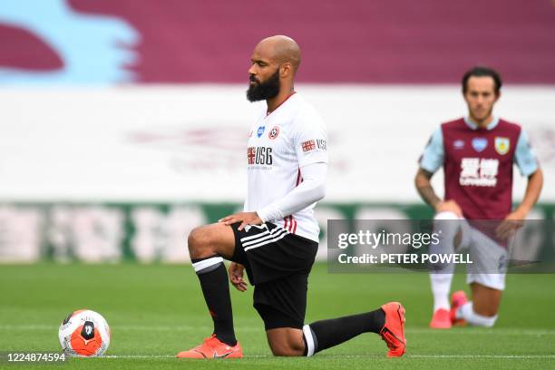 Sheffield United's English-born Irish striker David McGoldrick takes a knee to protest against racism and show solidarity with the Black Lives Matter...