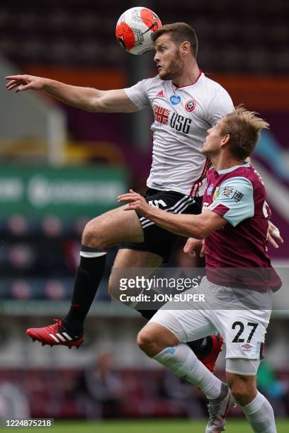 Sheffield United's English defender Jack O'Connell vies with Burnley's Czech striker Matej Vydra during the English Premier League football match...
