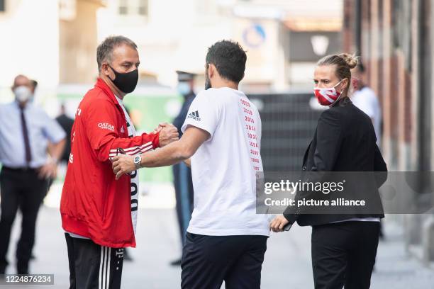 July 2020, Bavaria, Munich: Coach Hansi Flick , Hasan Salihamidzic, Sports Director of FC Bayern, and Kathleen Krüger, Team Manager of FC Bayern...