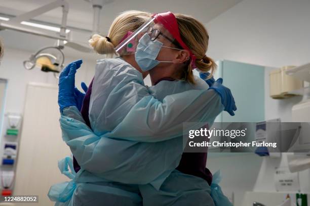 Dental nurses embrace before treating a possible Covid-19 positive dental patient at the Dental Unit at Coed Celyn Hospital. It is the only time the...