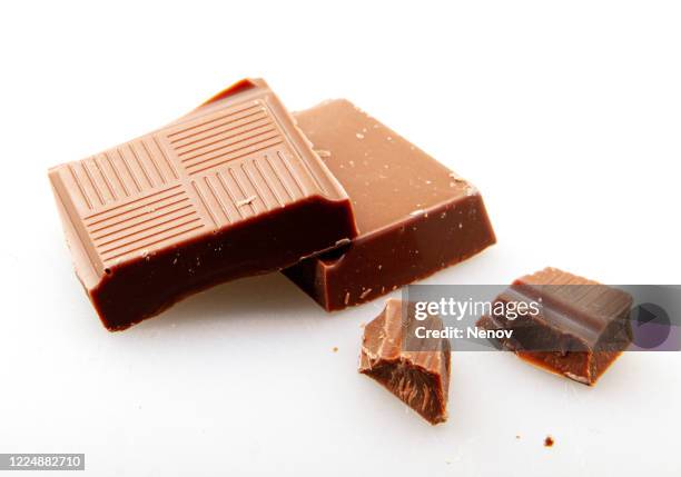 milk chocolate isolated on white background - caramel block stock pictures, royalty-free photos & images