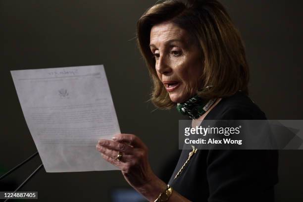Speaker of the House Rep. Nancy Pelosi reads from a note during a weekly news conference at the U.S. Capitol May 14, 2020 in Washington, DC. Speaker...
