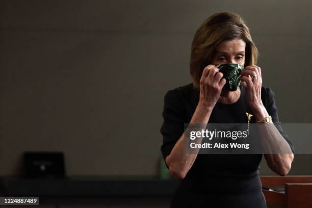 Speaker of the House Rep. Nancy Pelosi put her mask on after a weekly news conference at the U.S. Capitol May 14, 2020 in Washington, DC. Speaker...