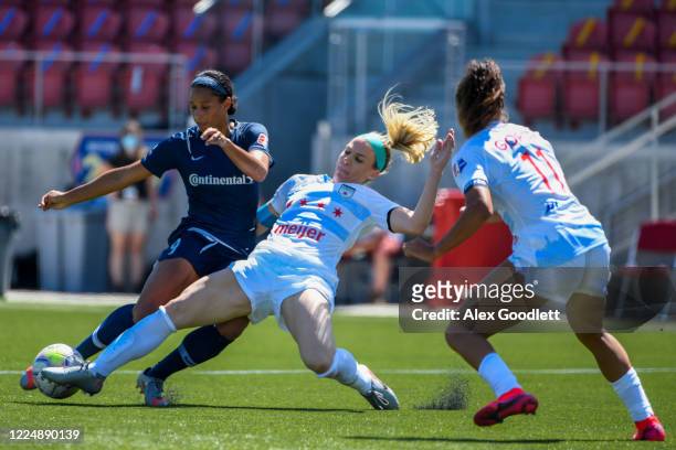 Julie Ertz of Chicago Red Stars fights for the ball with Lynn Williams of North Carolina Courage during a game on day 5 of the NWSL Challenge Cup at...