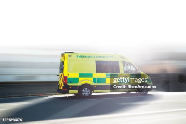 ambulance uk respond to an emergency in downtown - downtown stock pictures, royalty-free photos & images