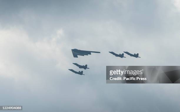 Stealth Bomber with escort of F-35 fighter jets fly over the Hudson River during the Fourth Of July Military Flyover as part of July 4th...