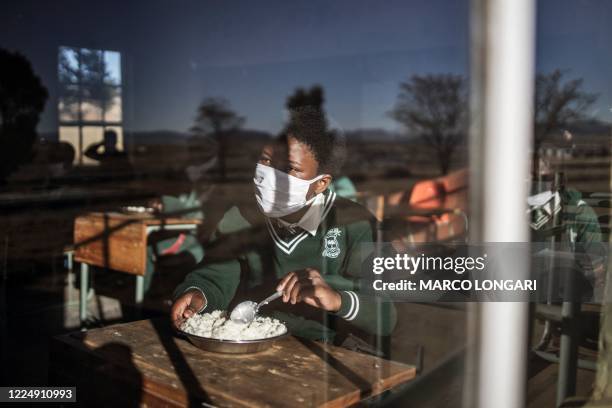 Grade 7 student of the Sitoromo Junior Secondary School in Sterkspruit, eats his breakfast on July 6, 2020. The school reopened today for their Grade...