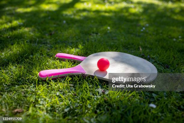 In this photo illustration a beachball Set is laying in the gras on June 22, 2020 in Oostkapelle, Netherlands.