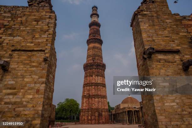 Deserted view of the United Nations Educational, Scientific and Cultural Organisation World Heritage Site of Qutub Minar complex, on July 06, 2020 in...