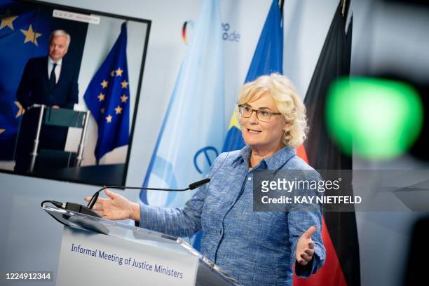 German Justice Minister Christine Lambrecht attends a press conference with European Commissioner for Justice Didier Reynder after a virtual meeting...