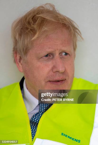 Britain's Prime Minister Boris Johnson, sporting a new hair cut, visits the Siemens Rail factory construction site in Goole, northeast England on...