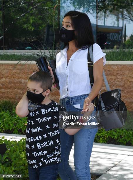 Illusionist Criss Angel's son Johnny Crisstopher Sarantakos and Shaunyl Benson come out to visit Angel as he helps to give out food and other items...