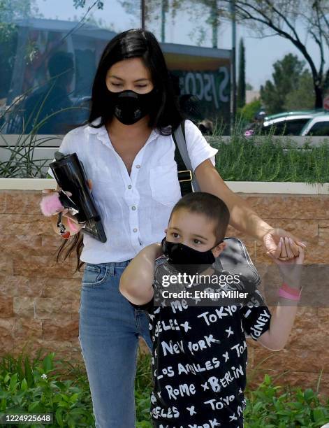 Illusionist Criss Angel's son Johnny Crisstopher Sarantakos and Shaunyl Benson come out to visit Angel as he helps to give out food and other items...