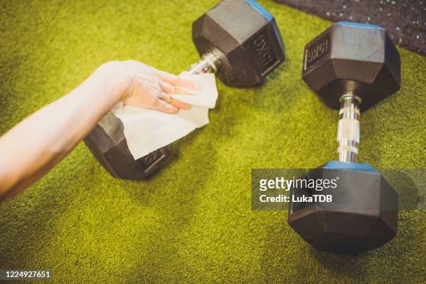 weights being cleaned - rubbing stock pictures, royalty-free photos & images
